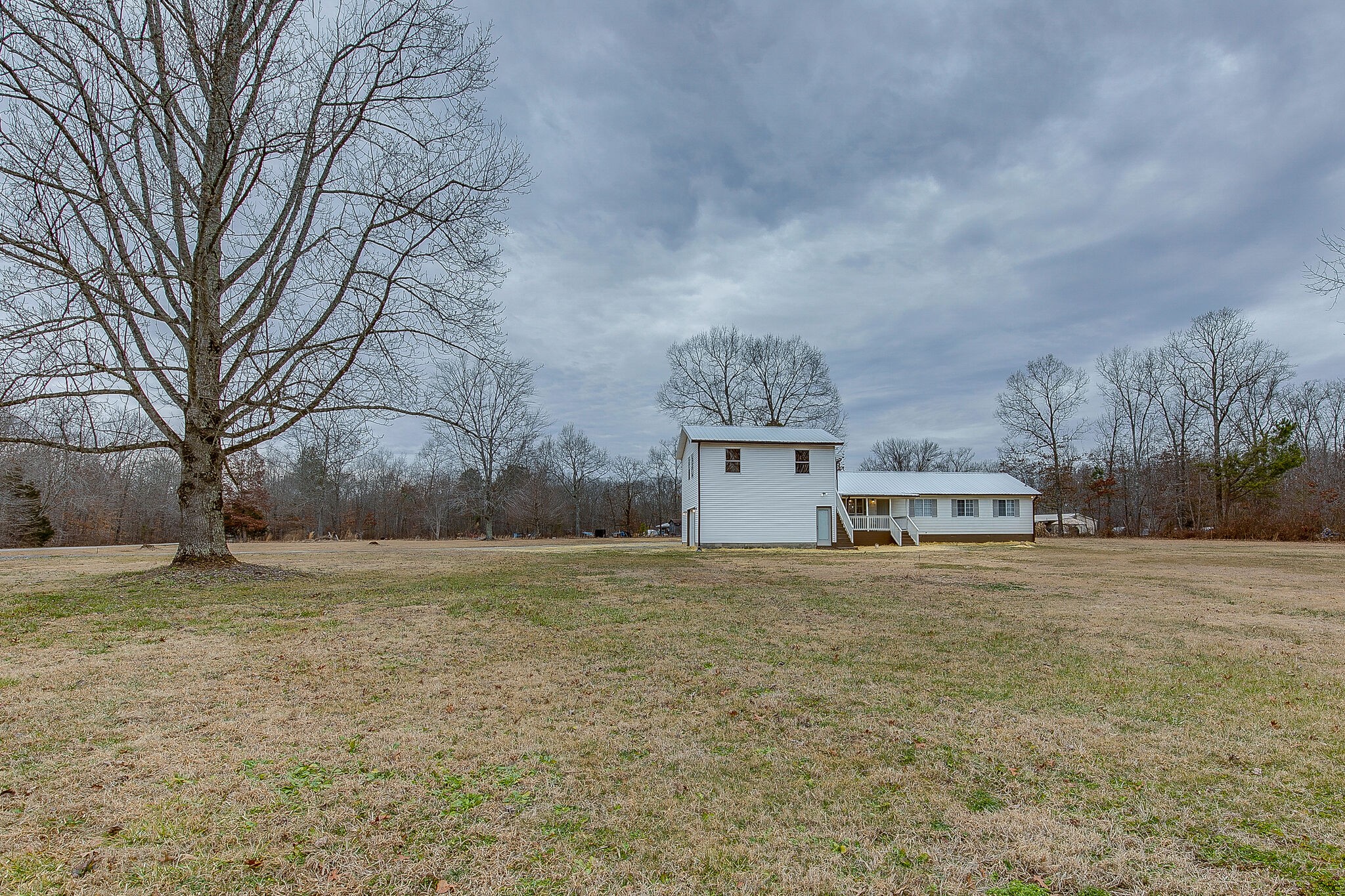 331 Alice Boynton Road Manchester, TN 37355 - Photo 3 of 22 a view of a house with a yard and garage