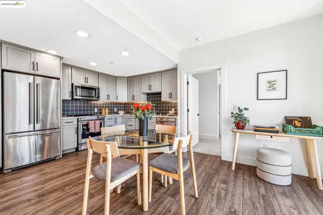 a kitchen with stainless steel appliances granite countertop a stove sink and cabinets