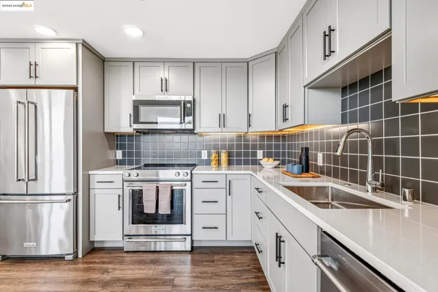 a bath tub sitting next to a bathroom sink