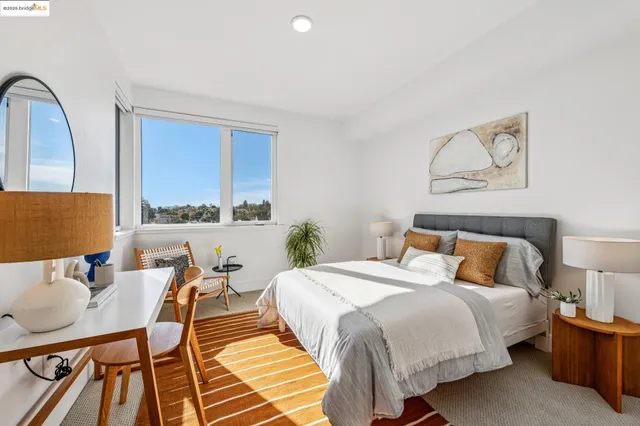 a room with a lamp and a potted plant