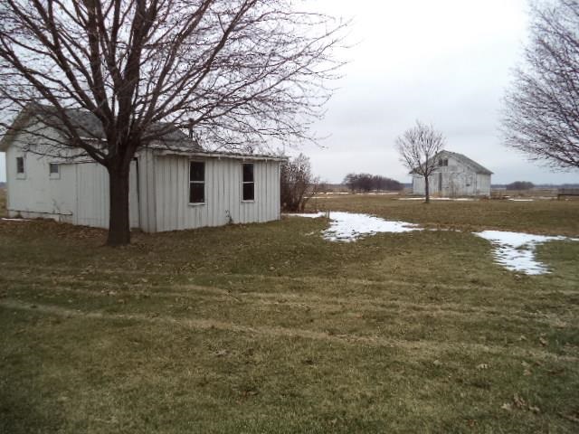7925 Centerville Road Capron, IL 61012 - Photo 17 of 18 a backyard of a house with lots of green space