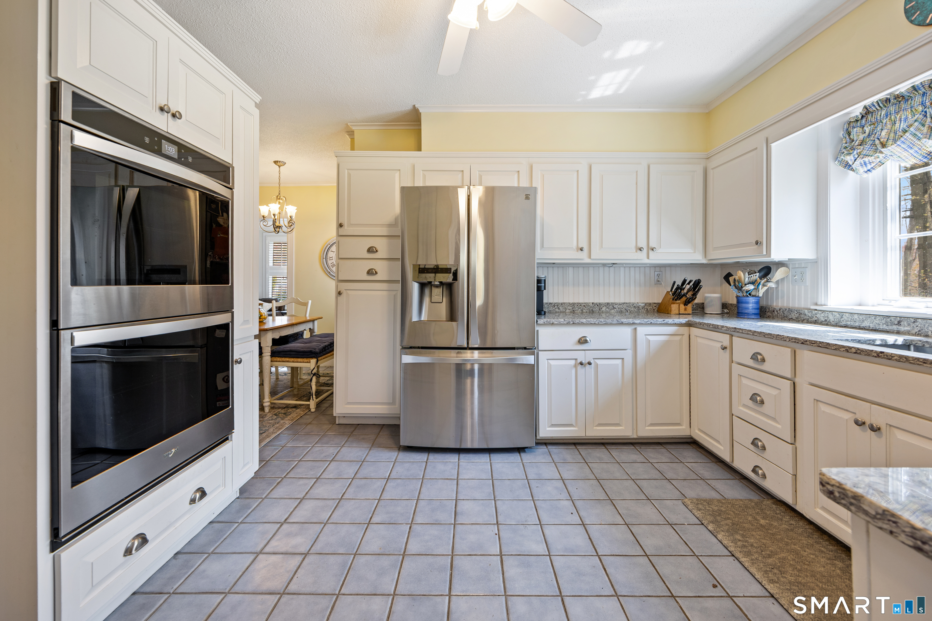 40 10 Acre Road New Britain, CT 06052 - Photo 7 of 38 a kitchen with a stove sink and refrigerator