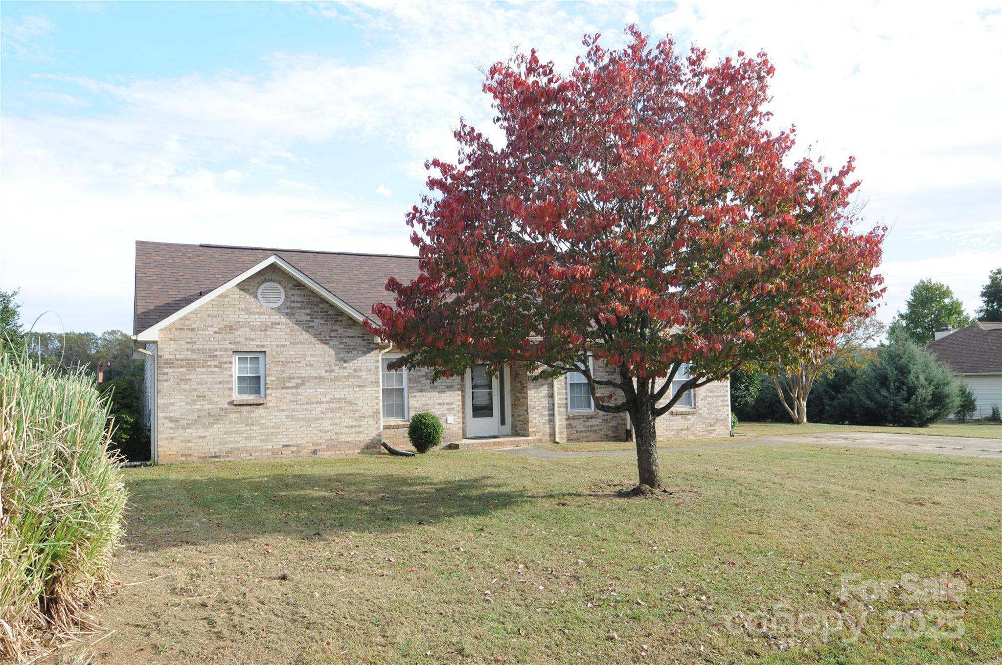 163 Planters Row Road Iron Station, NC 28080 - Photo 1 of 33 a front view of a house with a yard