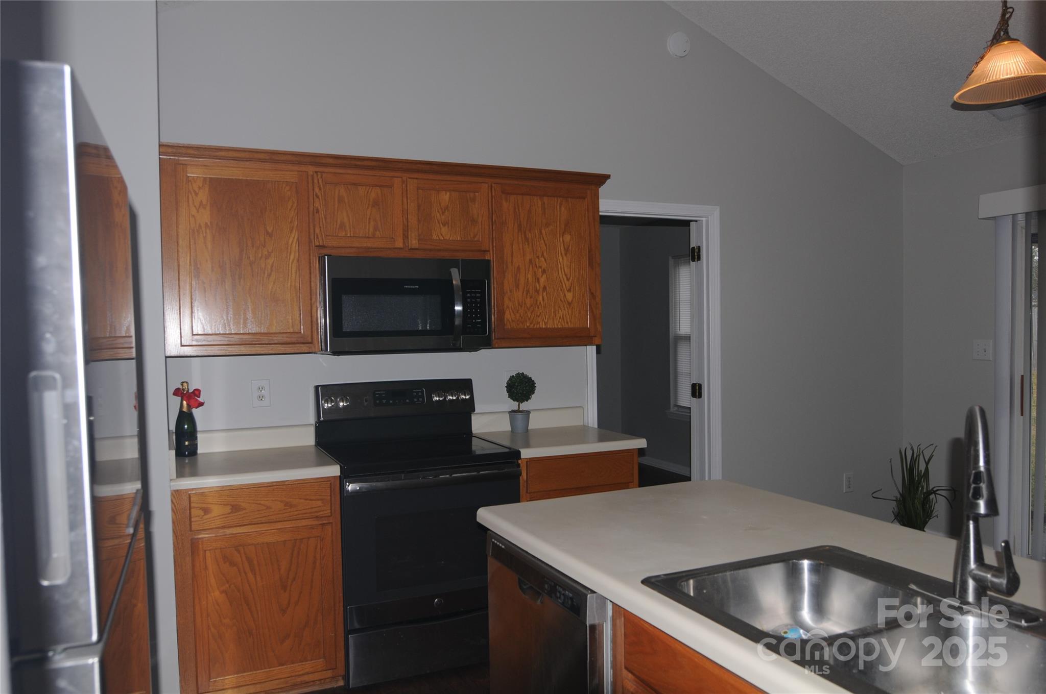 163 Planters Row Road Iron Station, NC 28080 - Photo 12 of 33 a kitchen with a sink and a refrigerator