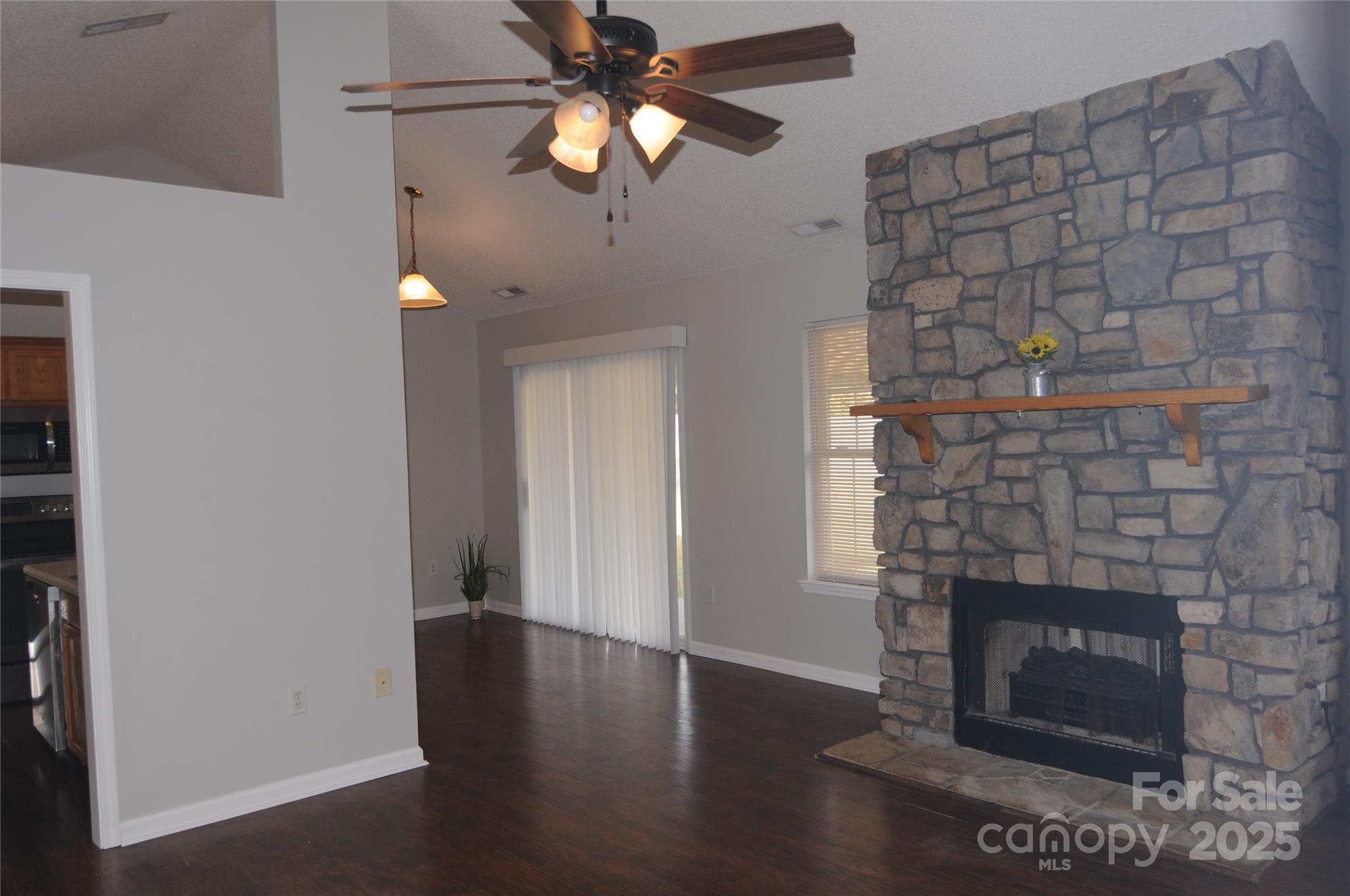 163 Planters Row Road Iron Station, NC 28080 - Photo 16 of 33 a living room with a fireplace