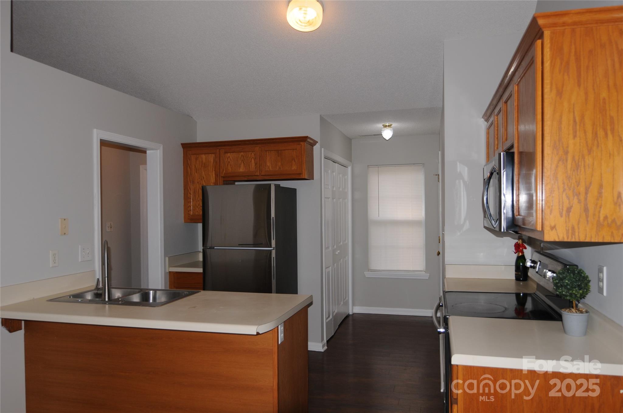 163 Planters Row Road Iron Station, NC 28080 - Photo 19 of 33 a kitchen with a sink and a refrigerator