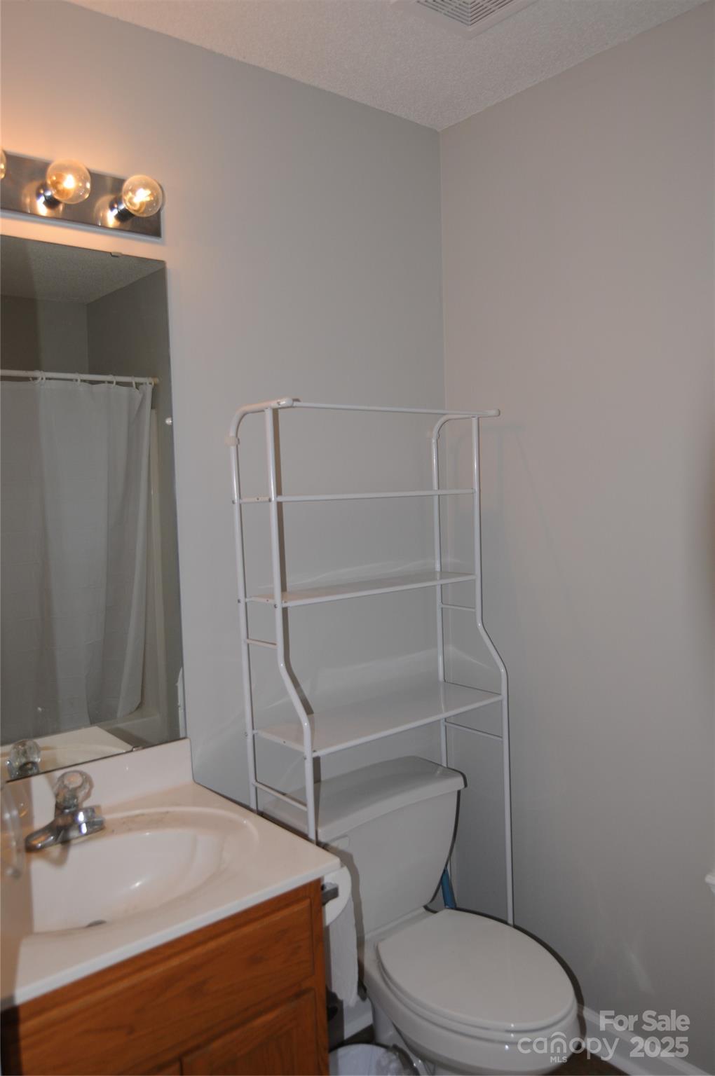 163 Planters Row Road Iron Station, NC 28080 - Photo 24 of 33 a bathroom with a toilet and a sink