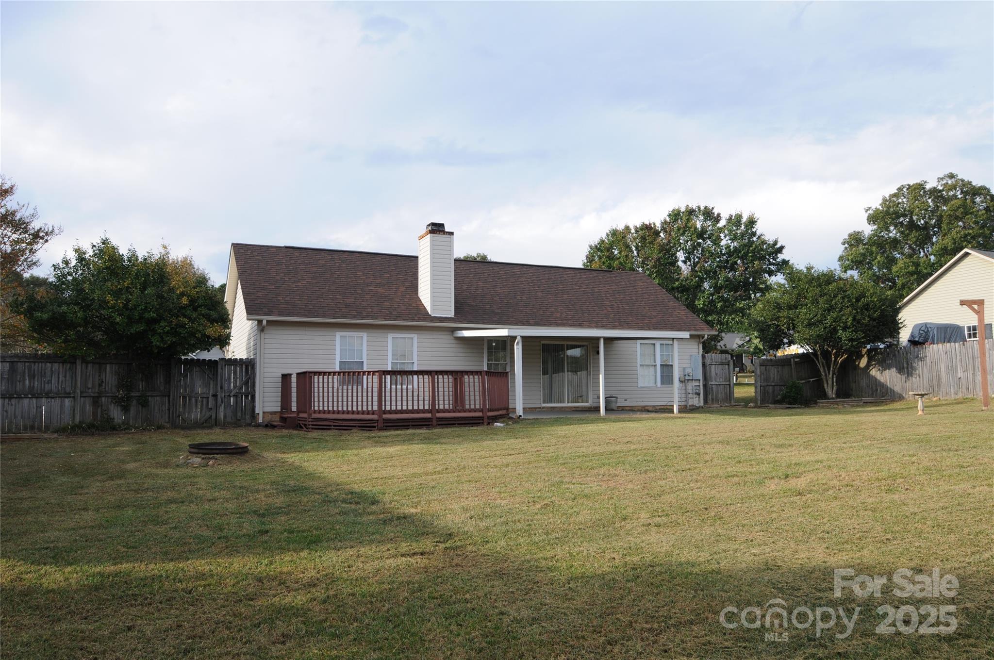 163 Planters Row Road Iron Station, NC 28080 - Photo 28 of 33 a view of a house with a yard and a large tree
