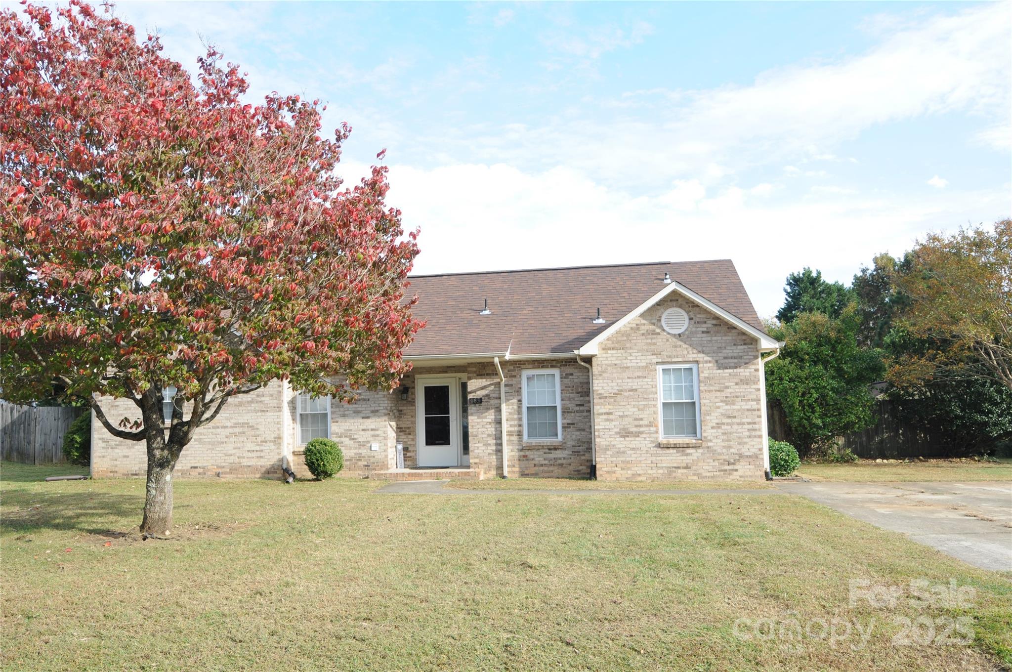 163 Planters Row Road Iron Station, NC 28080 - Photo 3 of 33 a house with trees in the background