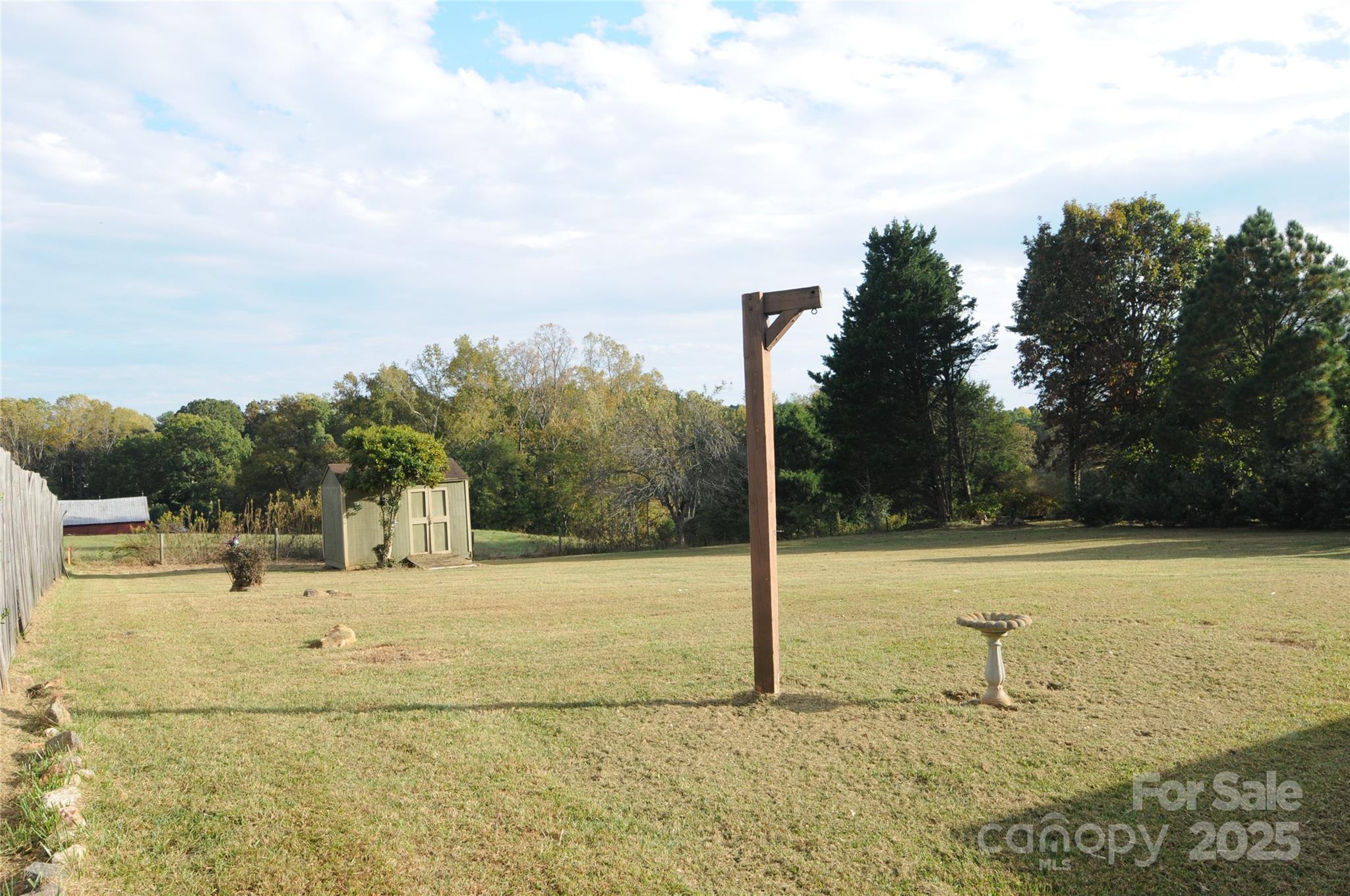 163 Planters Row Road Iron Station, NC 28080 - Photo 33 of 33 a view of a lake with a house in the background