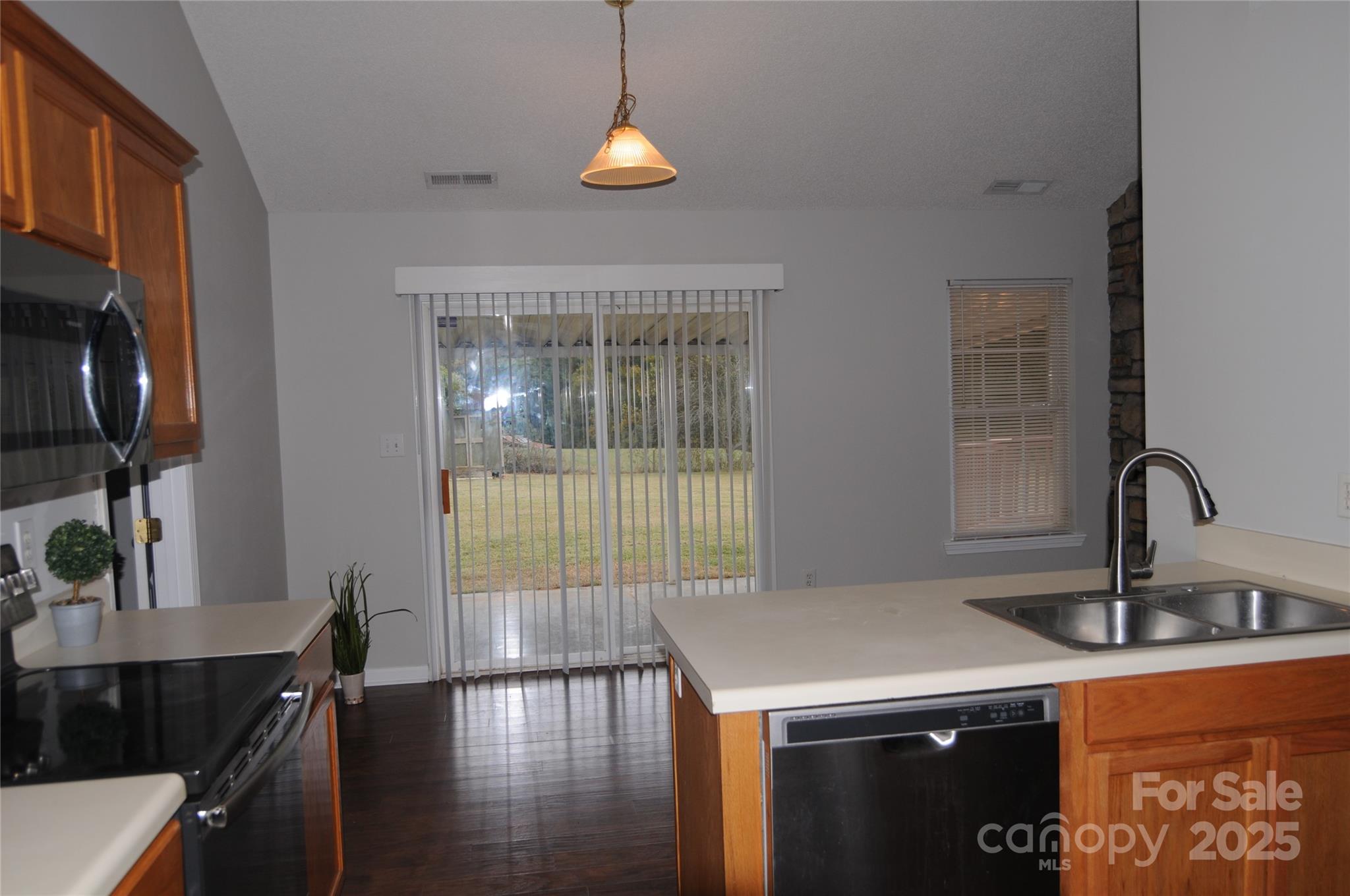 163 Planters Row Road Iron Station, NC 28080 - Photo 8 of 33 a kitchen with a sink and a stove top oven