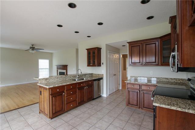 1013 Nuway Road Pleasant View, TN 37146 - Photo 10 of 20 Granite counters and stainless appliances bring this room to life. Kitchen also has bay for breakfast table.