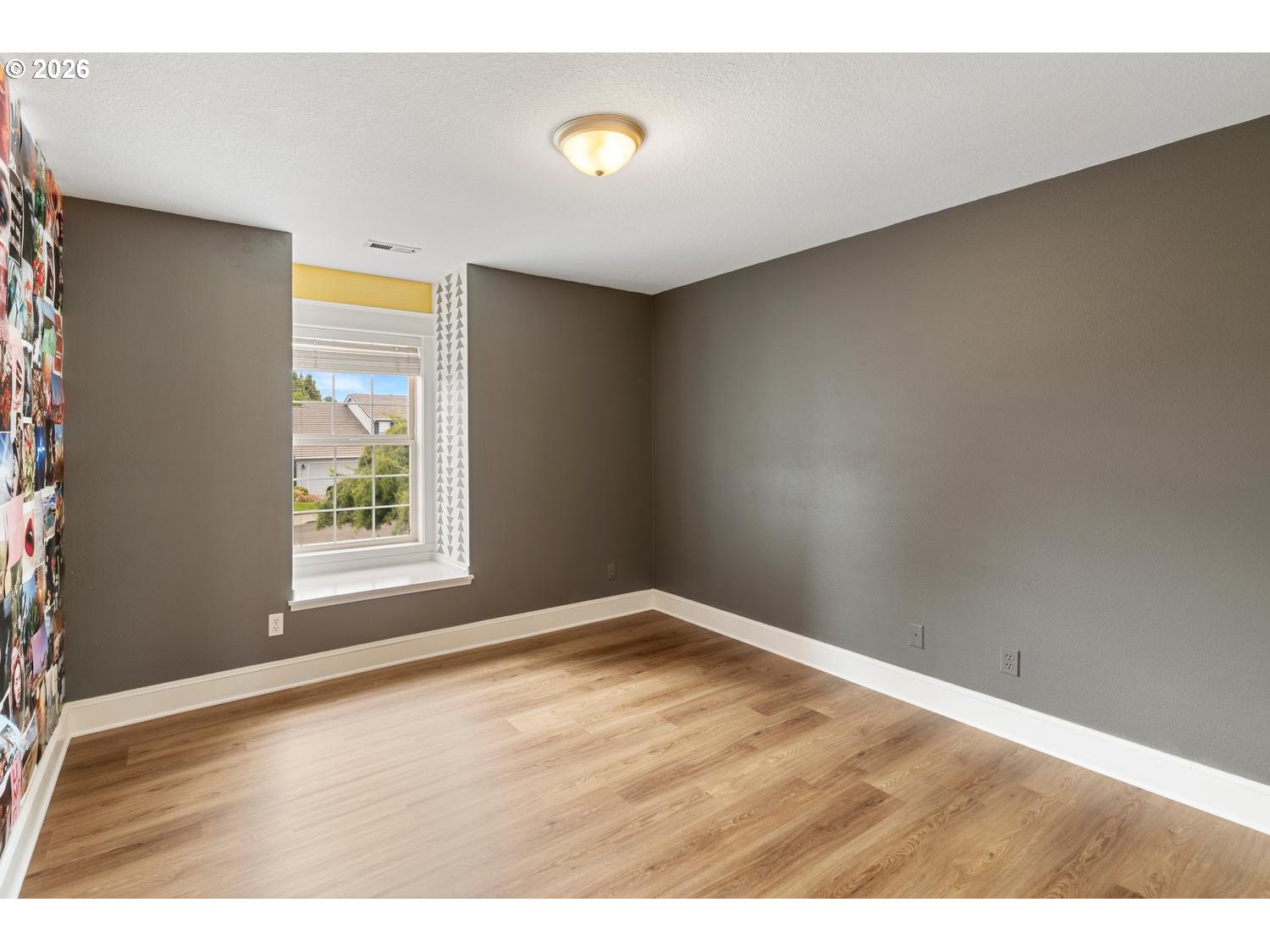 2519 Northwest 24th Circle Camas, WA 98607 - Photo 38 of 48 an empty room with wooden floor and windows