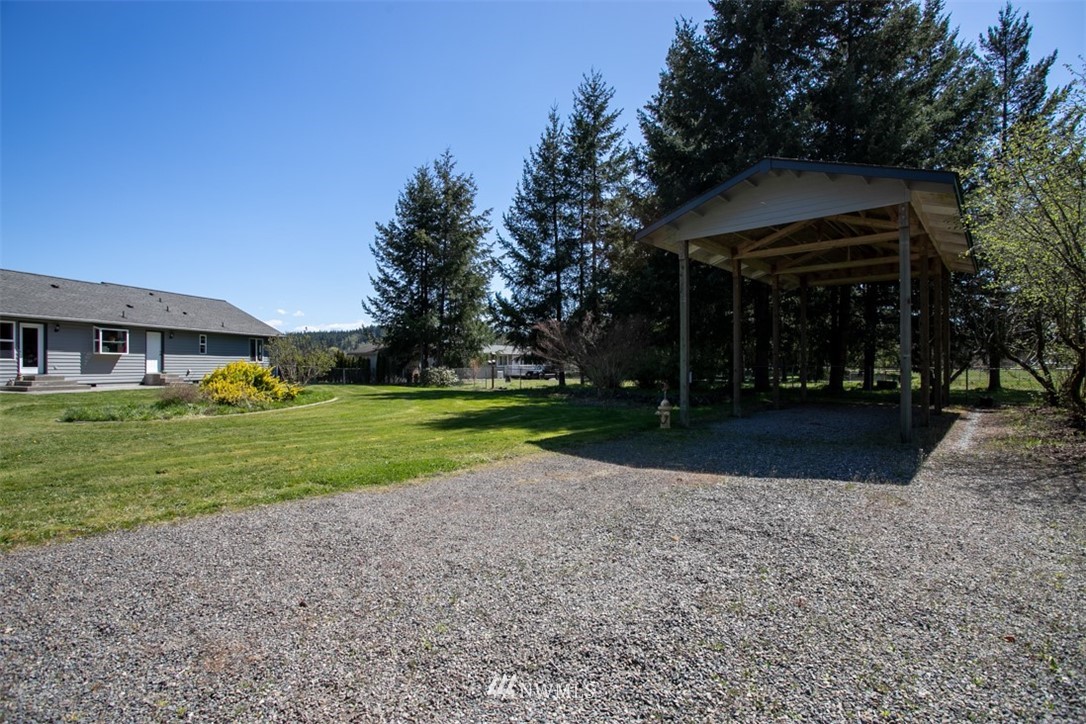18926 Nutmeg Street Southwest Rochester, WA 98579 - Photo 20 of 23 a view of a house with a yard
