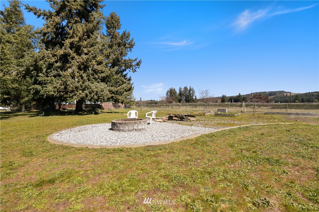 18926 Nutmeg Street Southwest Rochester, WA 98579 - Photo 21 of 23 a view of a lake with houses