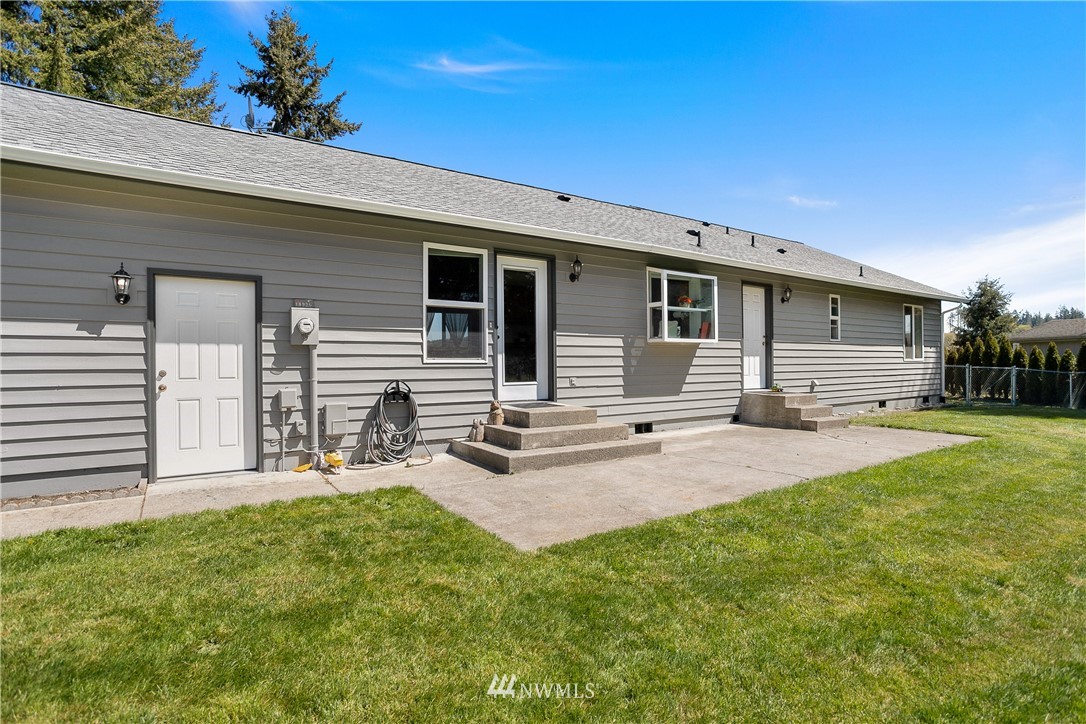 18926 Nutmeg Street Southwest Rochester, WA 98579 - Photo 4 of 23 a front view of house with yard and seating area