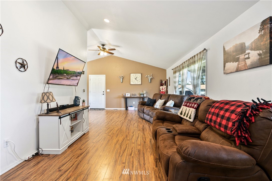 18926 Nutmeg Street Southwest Rochester, WA 98579 - Photo 6 of 23 a living room with furniture and wooden floor