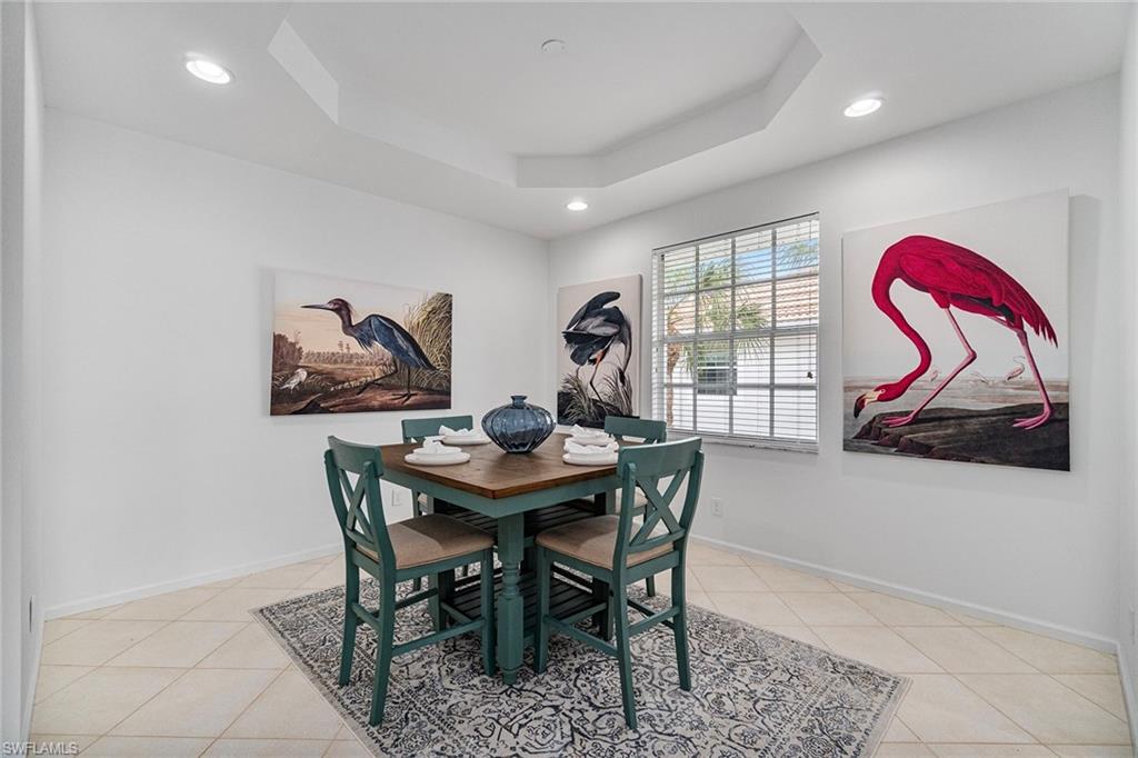 23081 Rosedale Drive, Unit 201 Estero, FL 34135 - Photo 13 of 18 a view of a dining room with furniture