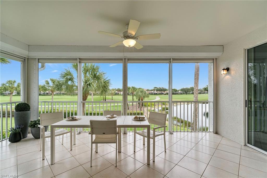 23081 Rosedale Drive, Unit 201 Estero, FL 34135 - Photo 15 of 18 a view of a balcony with chairs and a table