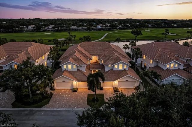 an aerial view of a house with outdoor space and street view