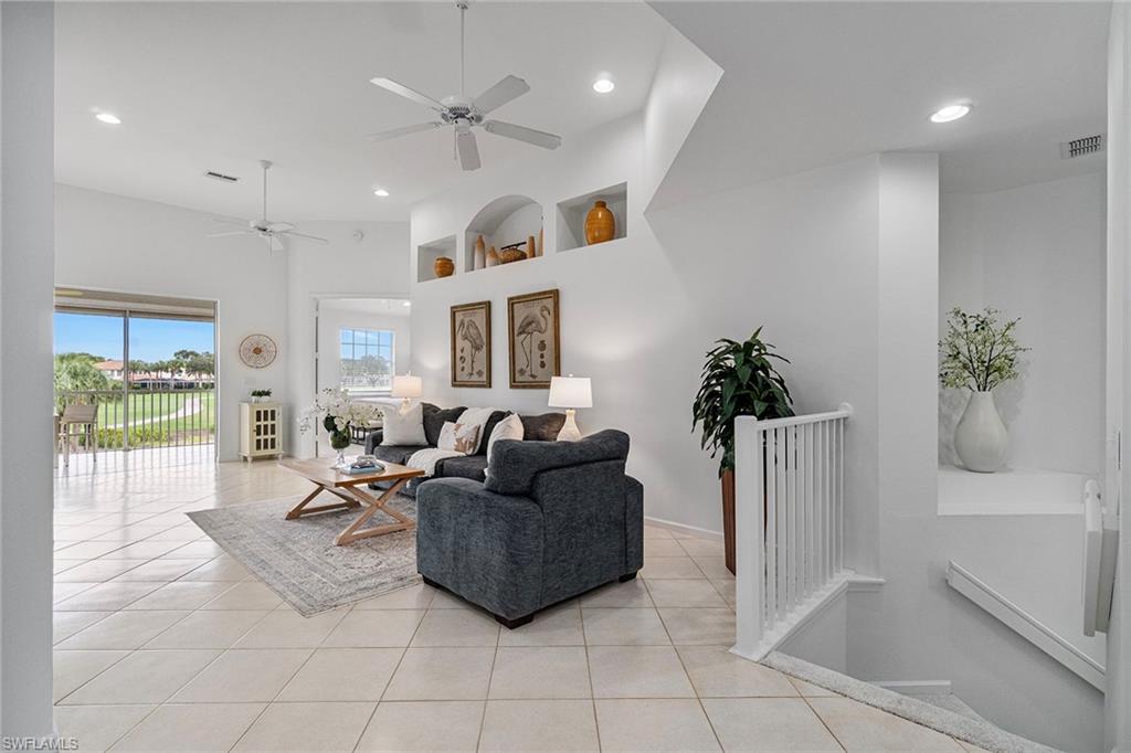 23081 Rosedale Drive, Unit 201 Estero, FL 34135 - Photo 4 of 18 a living room with furniture and a potted plant