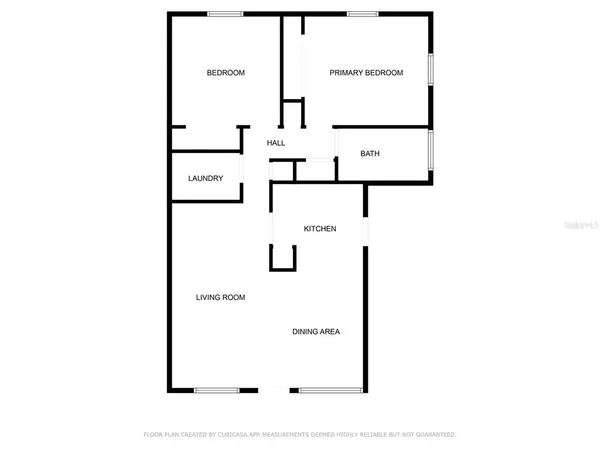 a view of kitchen with stainless steel appliances wooden floor and window