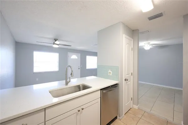 a kitchen with a stove and a refrigerator