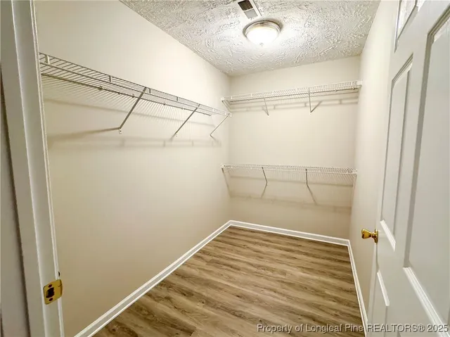 a view of a room with racks on the wall