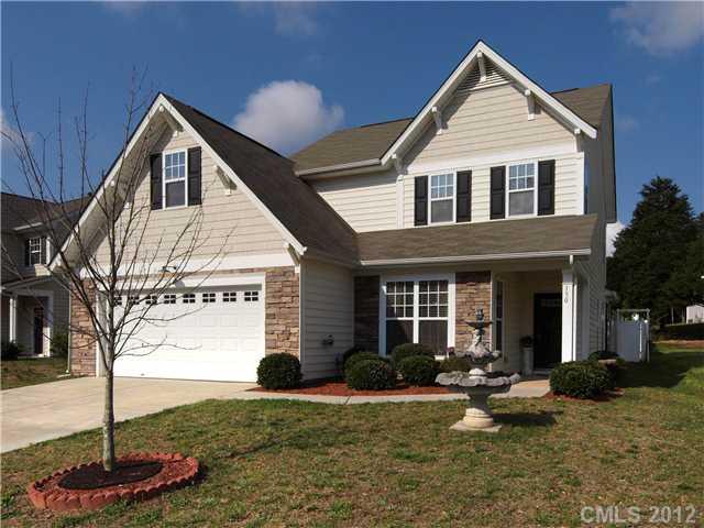 150 Whitley Mills Road Fort Mill, SC 29708 - Photo 1 of 16 a front view of a house with garden