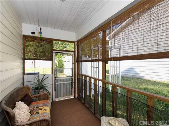 150 Whitley Mills Road Fort Mill, SC 29708 - Photo 14 of 16 a view of a porch with furniture and floor to ceiling window