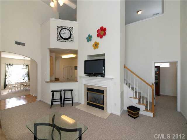 150 Whitley Mills Road Fort Mill, SC 29708 - Photo 3 of 16 a living room with furniture and a flat screen tv