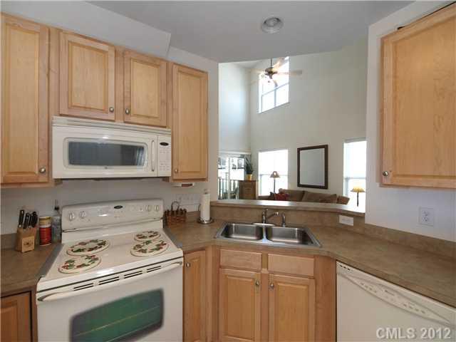 150 Whitley Mills Road Fort Mill, SC 29708 - Photo 6 of 16 a kitchen with appliances a sink and a cabinets