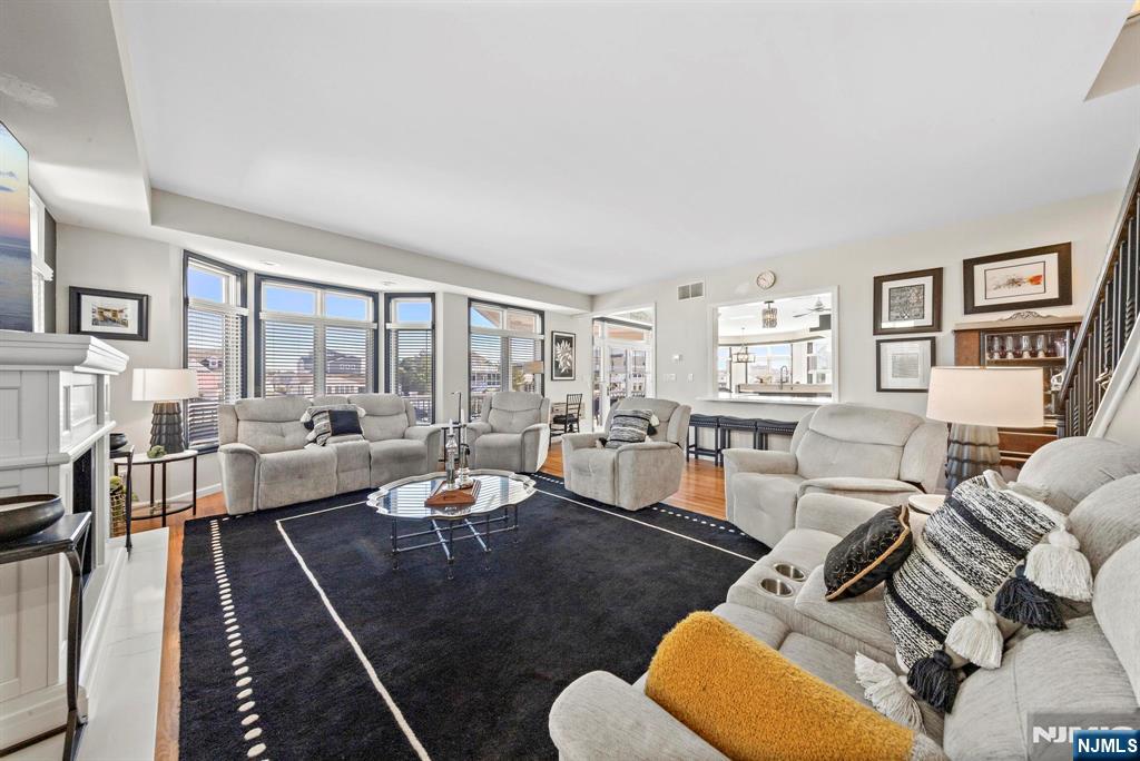 19 Maryland Road Little Egg Harbor, NJ 08087 - Photo 16 of 48 a living room with furniture fireplace and a large window