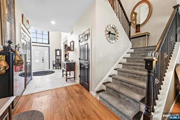 a view of a livingroom with furniture and stairs