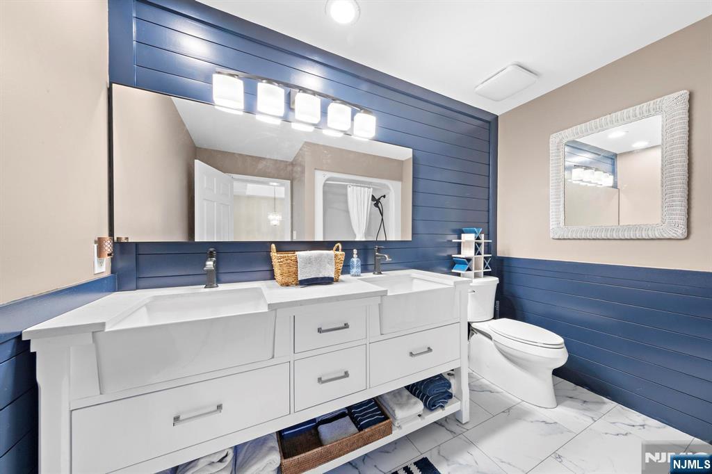 19 Maryland Road Little Egg Harbor, NJ 08087 - Photo 37 of 48 a bathroom with a toilet sink and mirror