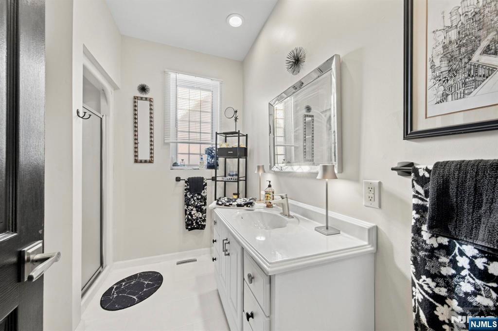 19 Maryland Road Little Egg Harbor, NJ 08087 - Photo 38 of 48 a bathroom with a sink and a mirror