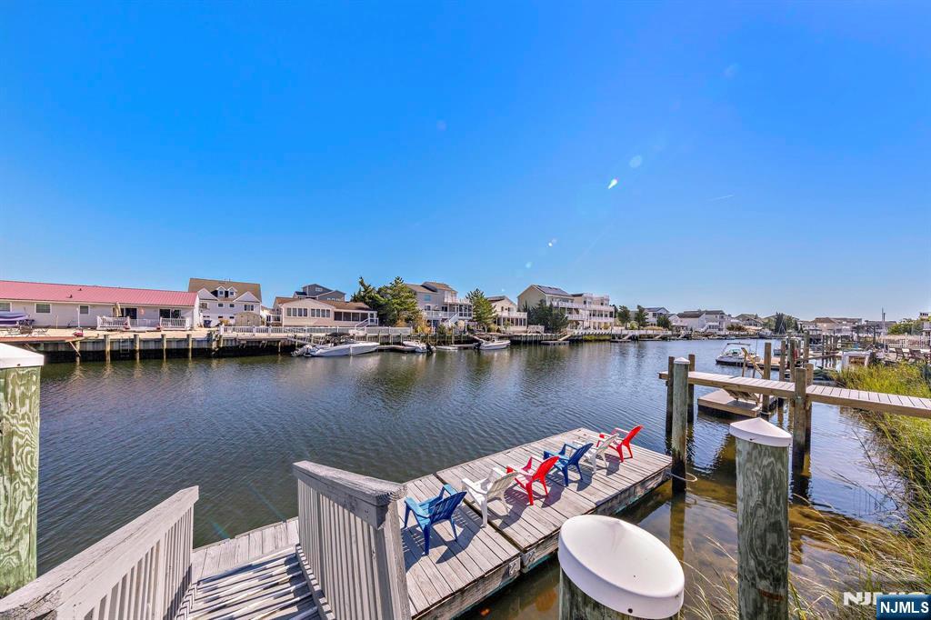 19 Maryland Road Little Egg Harbor, NJ 08087 - Photo 47 of 48 a view of a lake with a table and chairs