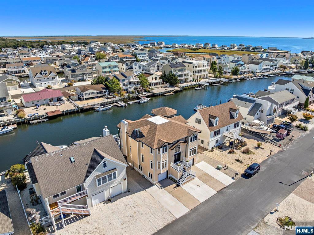 19 Maryland Road Little Egg Harbor, NJ 08087 - Photo 5 of 48 an aerial view of a house with table and chairs