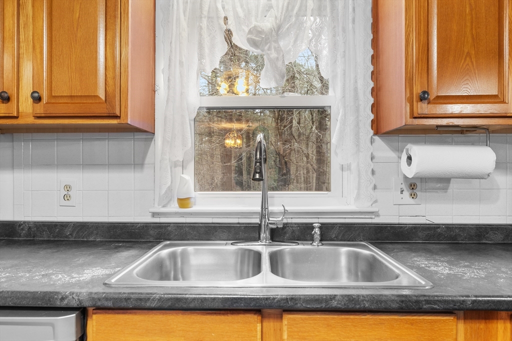 58 Lakeview Road Foxboro, MA 02035 - Photo 16 of 42 a kitchen with a sink and a window