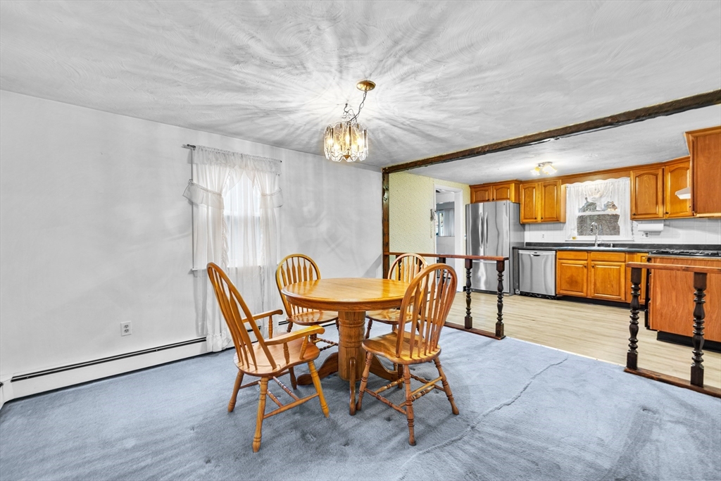 58 Lakeview Road Foxboro, MA 02035 - Photo 17 of 42 a view of a dining room with furniture window and wooden floor