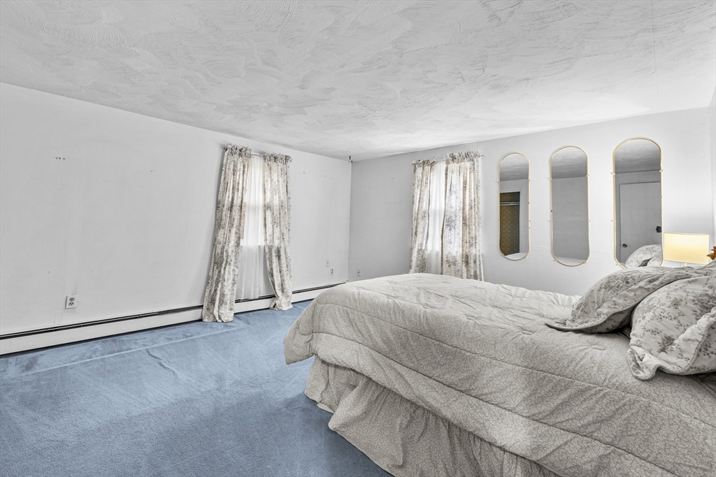 58 Lakeview Road Foxboro, MA 02035 - Photo 24 of 42 a bedroom with a bed and a window