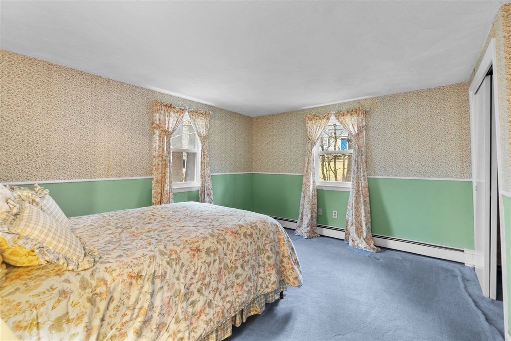 58 Lakeview Road Foxboro, MA 02035 - Photo 25 of 42 a bedroom with a bed and a window