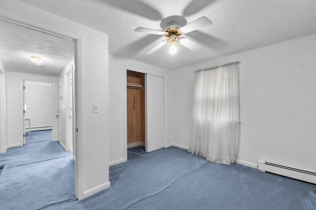 58 Lakeview Road Foxboro, MA 02035 - Photo 27 of 42 an empty space with closet and a chandelier fan