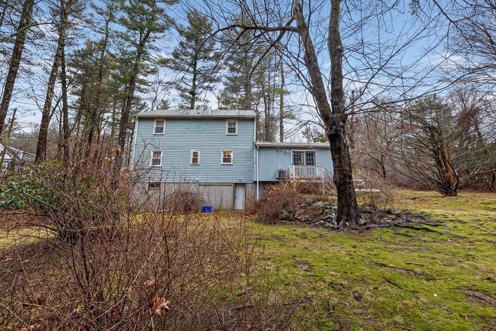 58 Lakeview Road Foxboro, MA 02035 - Photo 29 of 42 a view of a house with a large tree and a yard