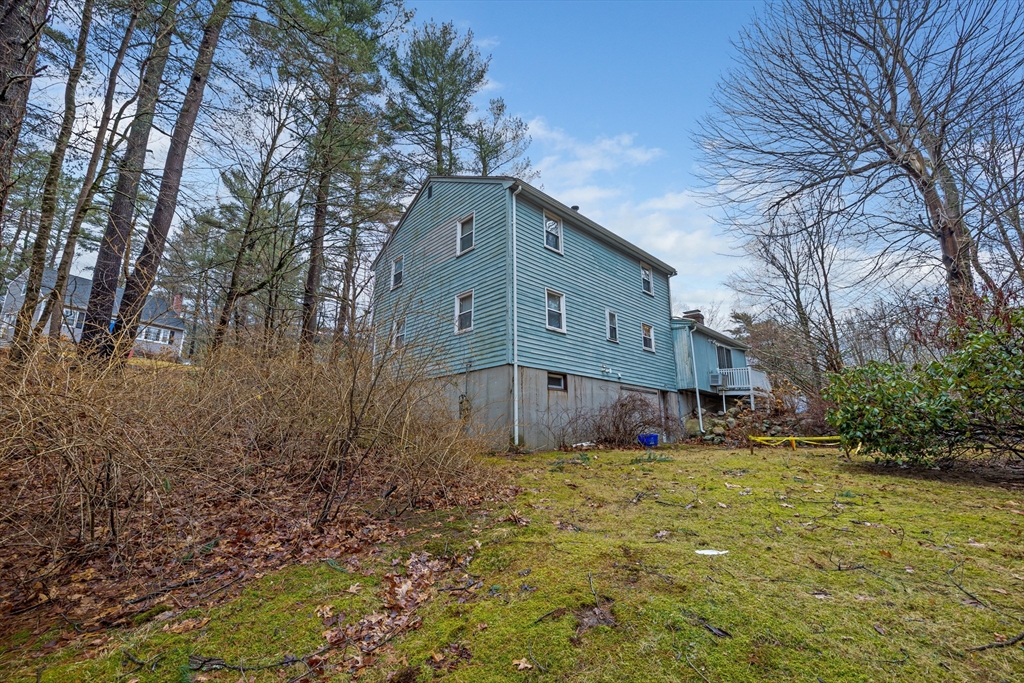 58 Lakeview Road Foxboro, MA 02035 - Photo 3 of 42 a front view of house with yard and trees in the background