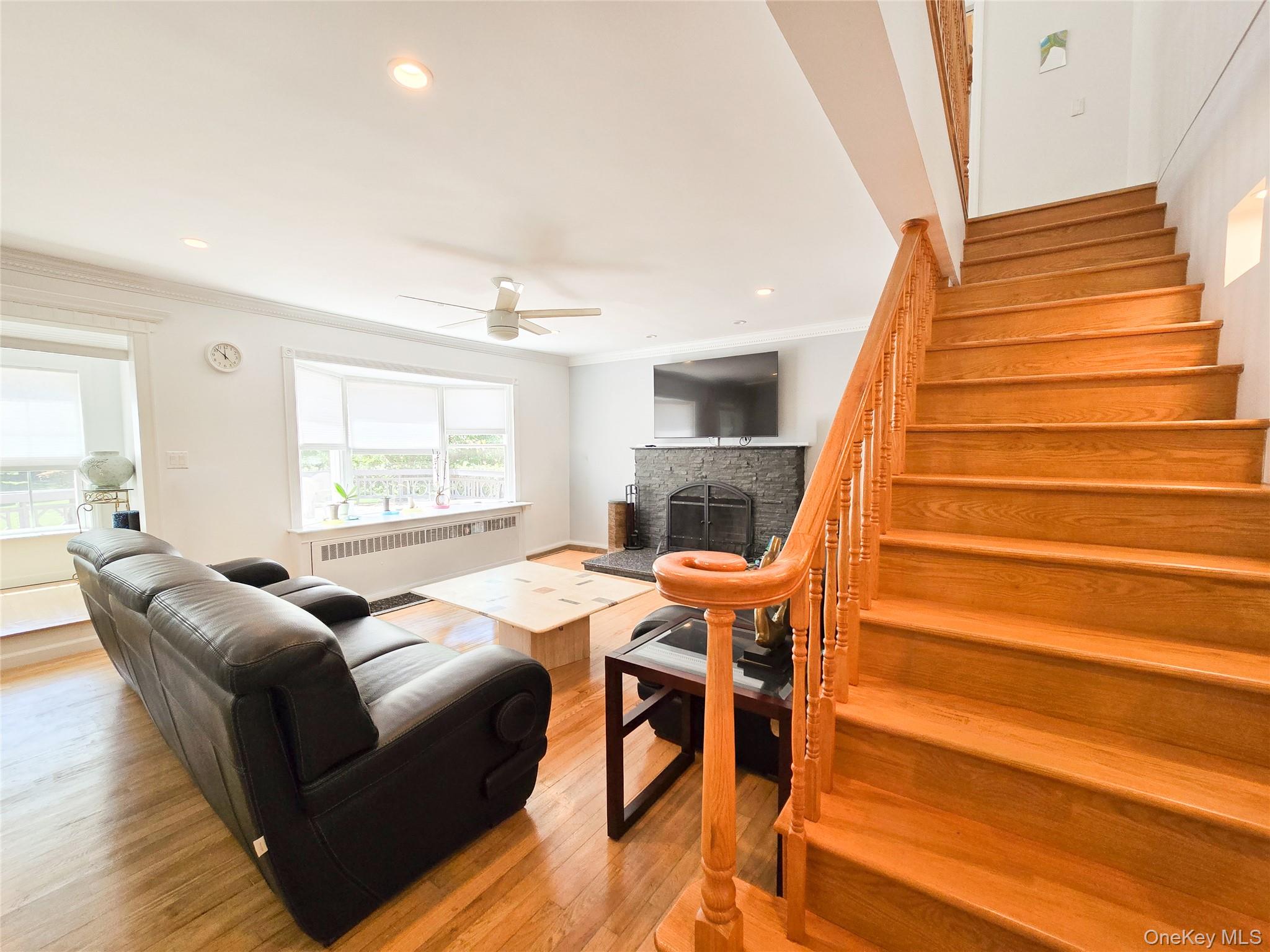 249 Cold Spring Road Syosset, NY 11791 - Photo 6 of 28 a living room with furniture and a wooden floor