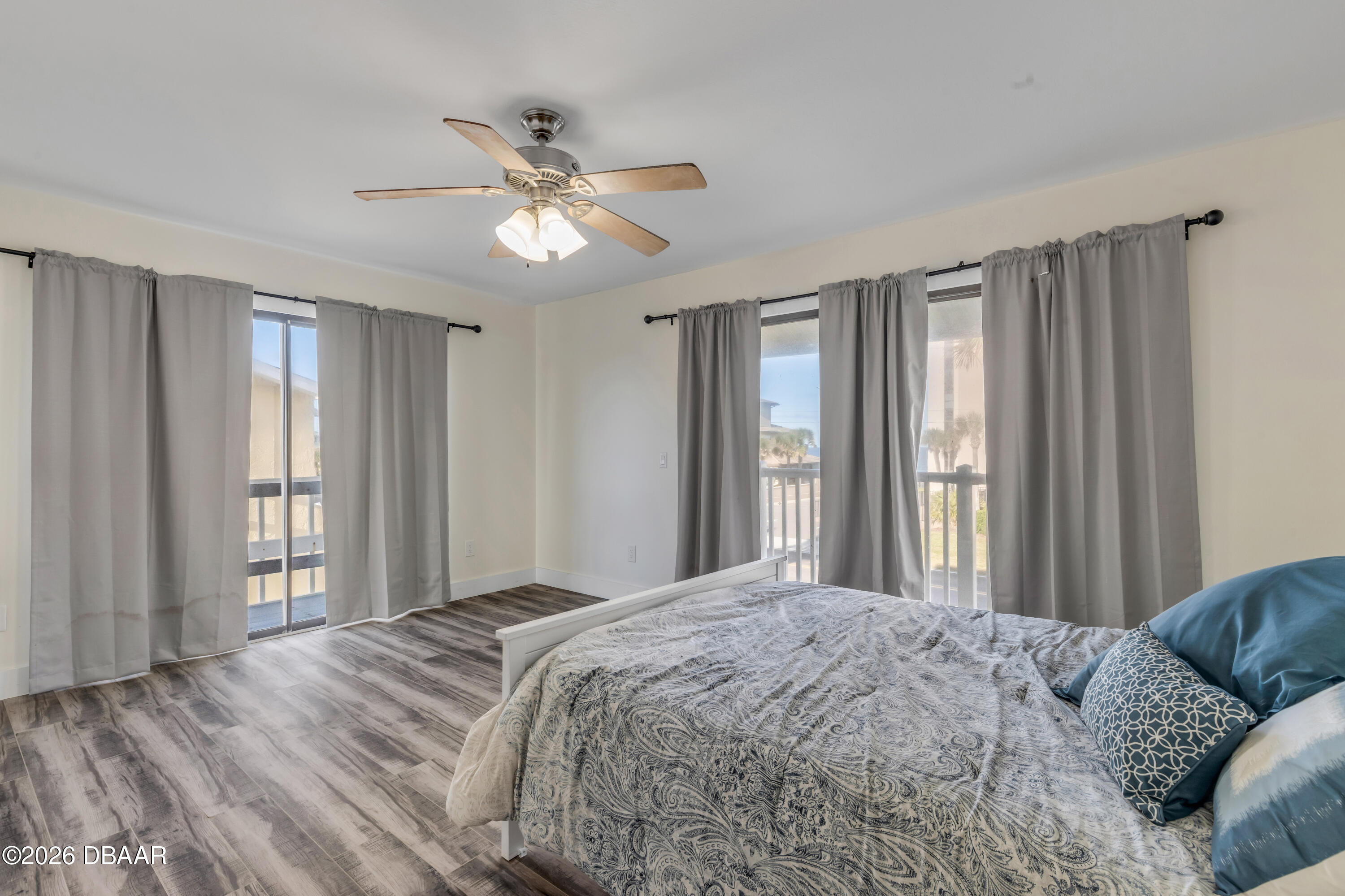 4752 South Atlantic Avenue, Unit 1 Ponce Inlet, FL 32127 - Photo 31 of 49 a bedroom with a large bed and a window
