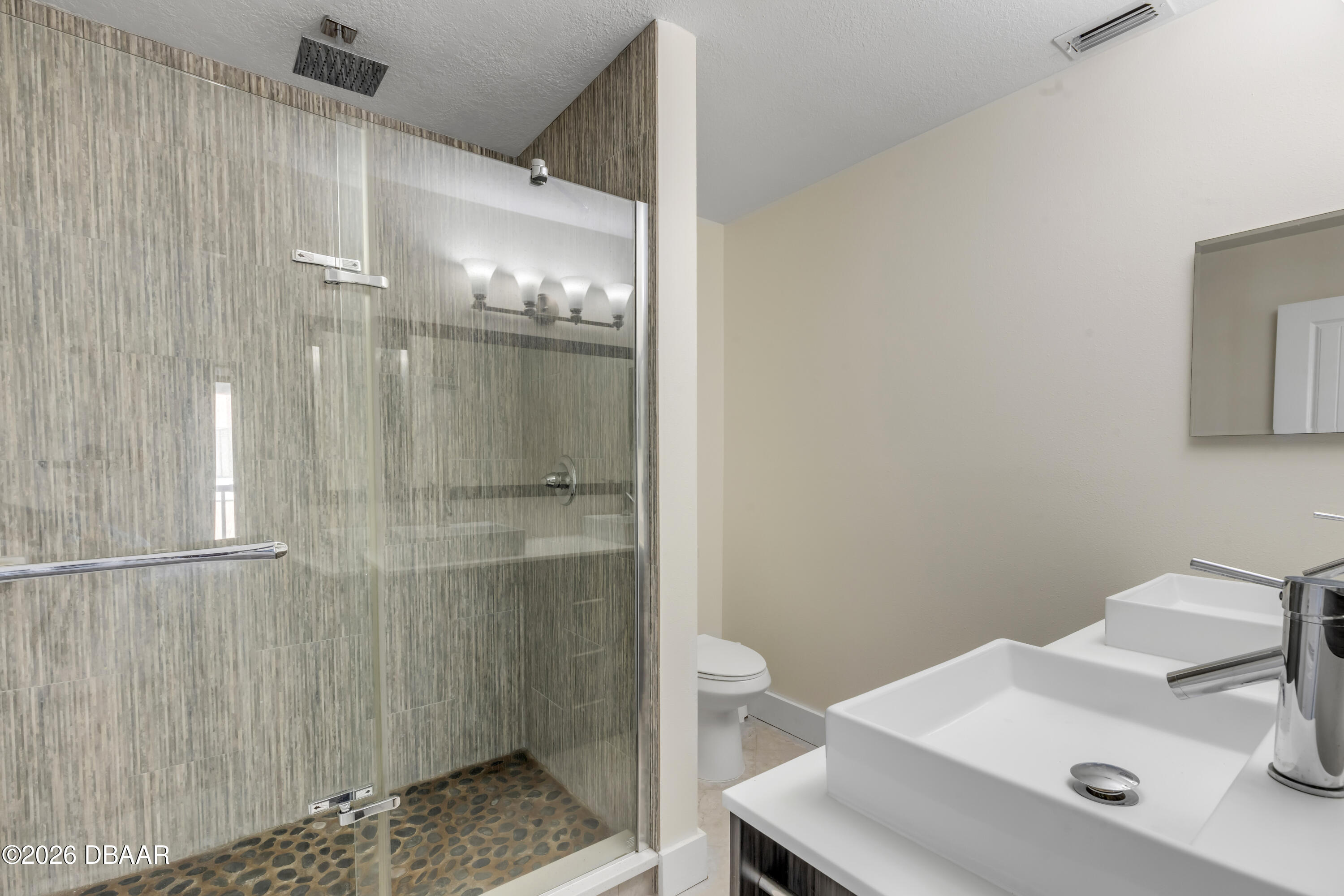 4752 South Atlantic Avenue, Unit 1 Ponce Inlet, FL 32127 - Photo 33 of 49 a bathroom with a sink and mirror