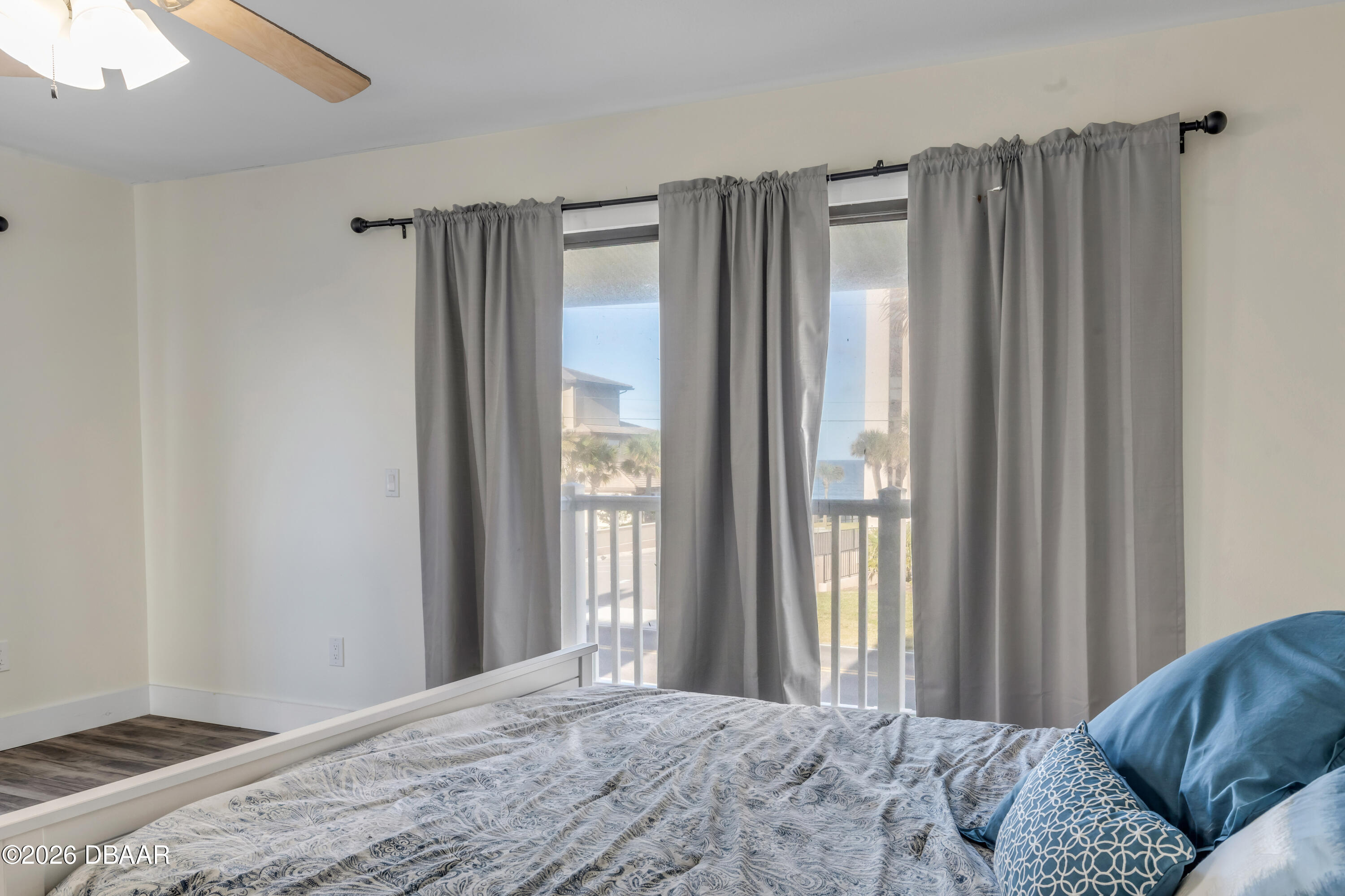 4752 South Atlantic Avenue, Unit 1 Ponce Inlet, FL 32127 - Photo 35 of 49 a bedroom with a bed and a window