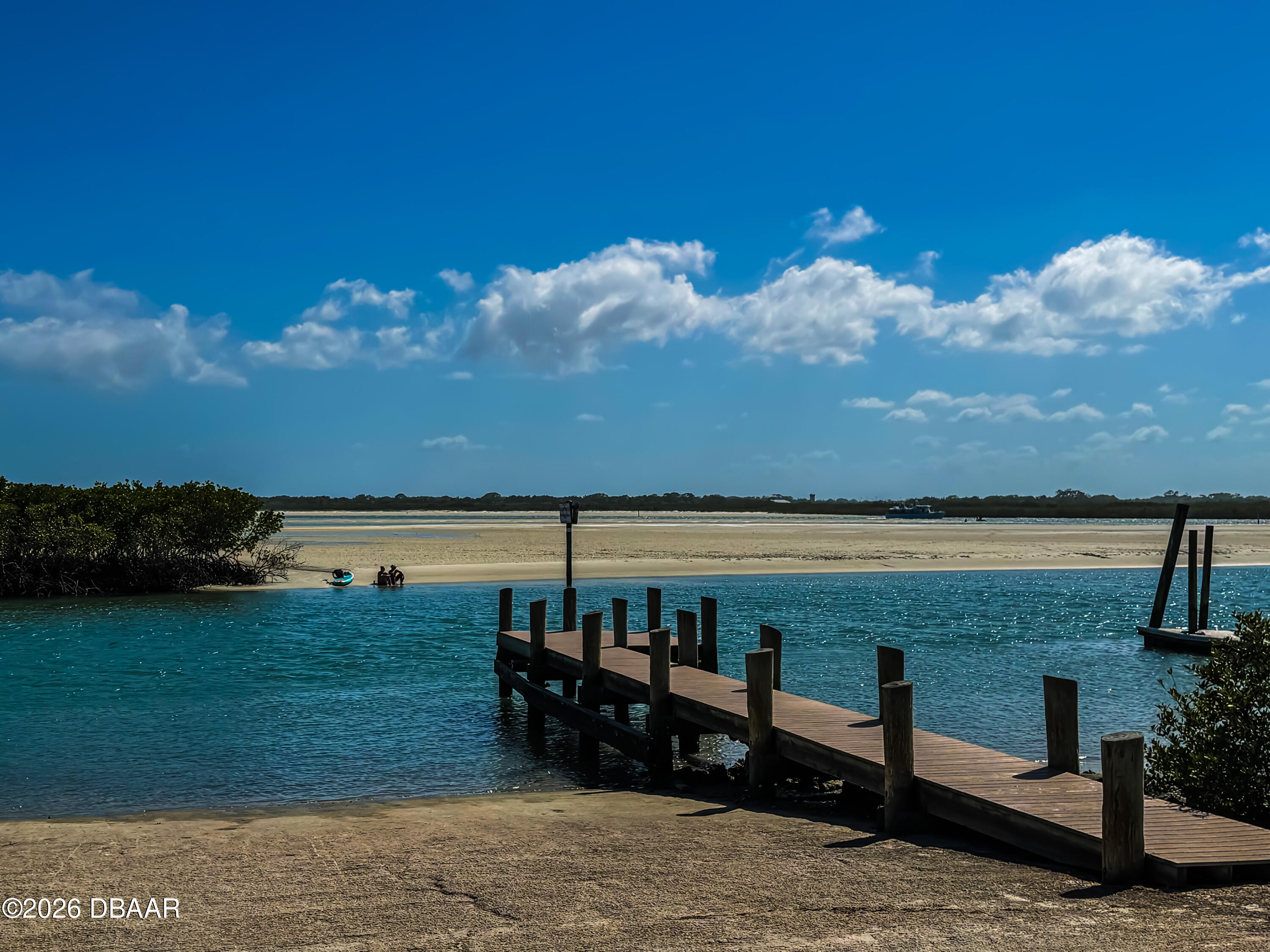 4752 South Atlantic Avenue, Unit 1 Ponce Inlet, FL 32127 - Photo 47 of 49 a view of a lake from a yard